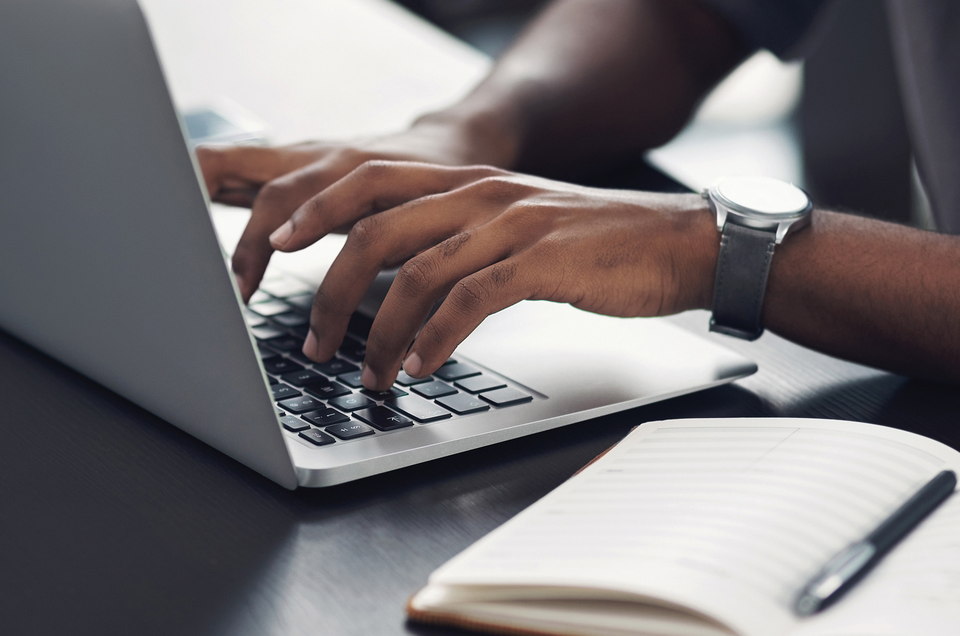 Man typing on laptop